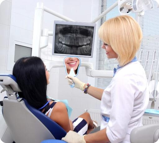 Dentist talking to dental patient