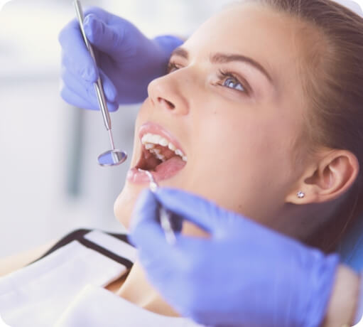 Woman receiving oral cancer screening