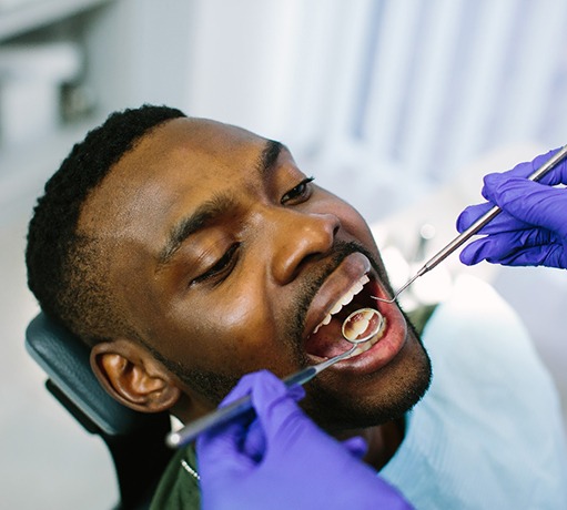 Man having dental examination done.