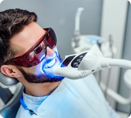 Dental patient receiving teeth whitening