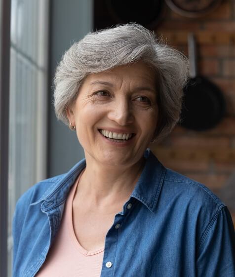 Woman with dentures smiling