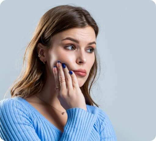 Woman with tooth infection before root canal treatment