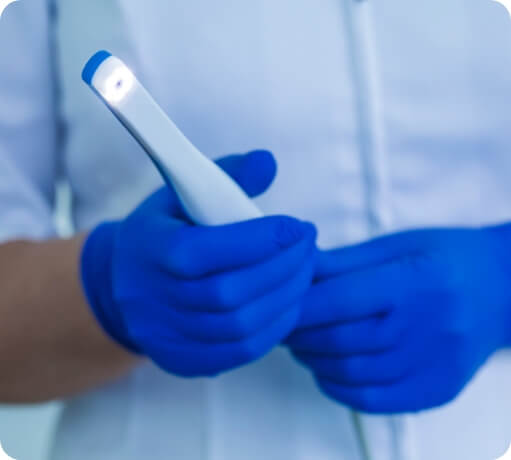 Dentist holding intraoral camera