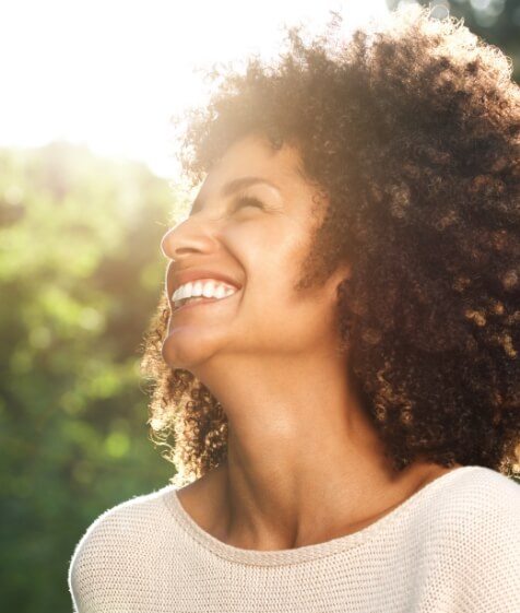 Woman with beautiful smile thanks to veneers