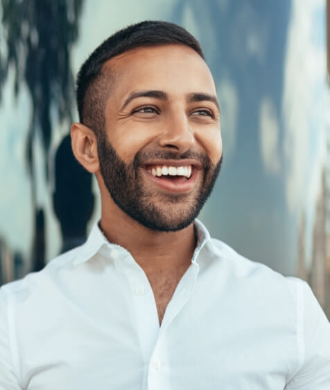 Man with bright smile thanks to teeth whitening