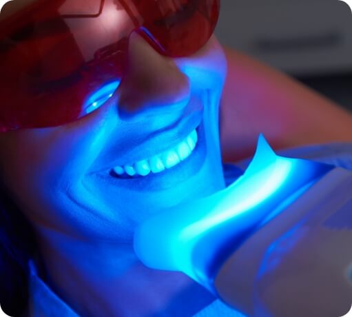 Dental patient receiving in office teeth whitening treatment